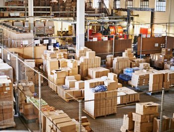 Shot of the interior of a large packaging and distribution warehouse